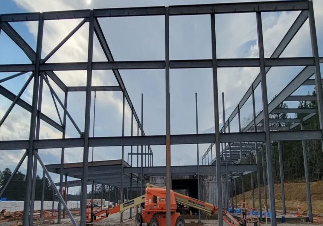 A construction site with some large metal frames.